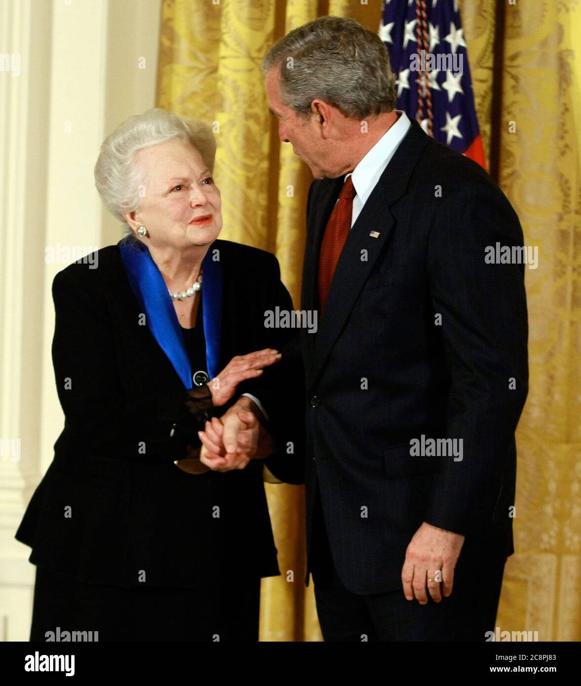 Washington, DC. 17th Nov, 2008. Washington, DC - November 17, 2008 -- United States President George W. Bush congratulates actress Olivia de Havilland after presenting her with the 2008 National Medals of Arts award during an event in the East Room at the White House on Monday, November 17, 2008 in Washington, DC. During the event president Bush presented recipients with awards for the National Medals of Arts and the National Humanities Medal.Credit: Mark Wilson - Pool via CNP | usage worldwide Credit: dpa/Alamy Live News Stock Photo