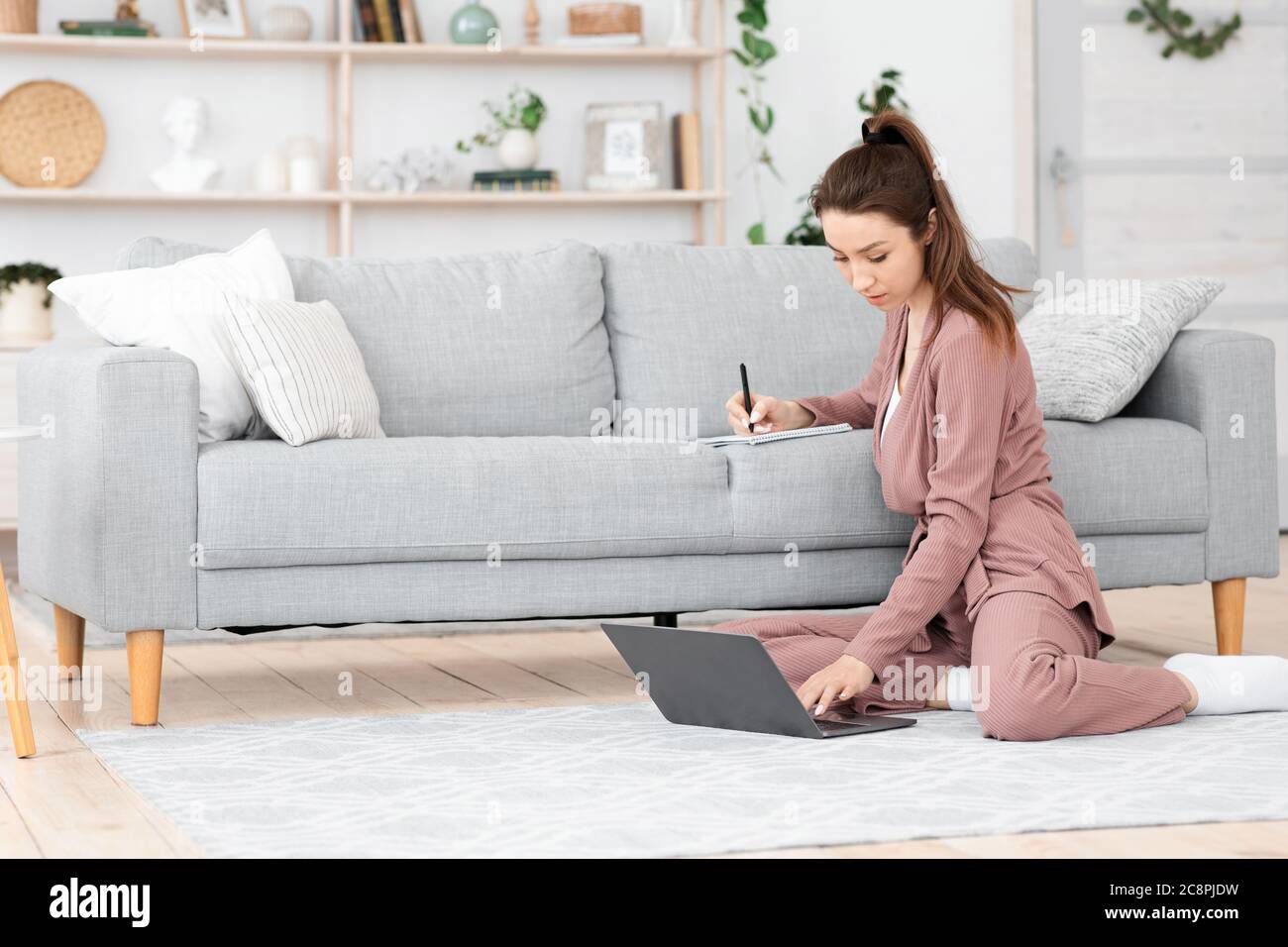Recruitment Concept. Young Woman Searching Job Online, Browsing Work Opportunities On Laptop Stock Photo
