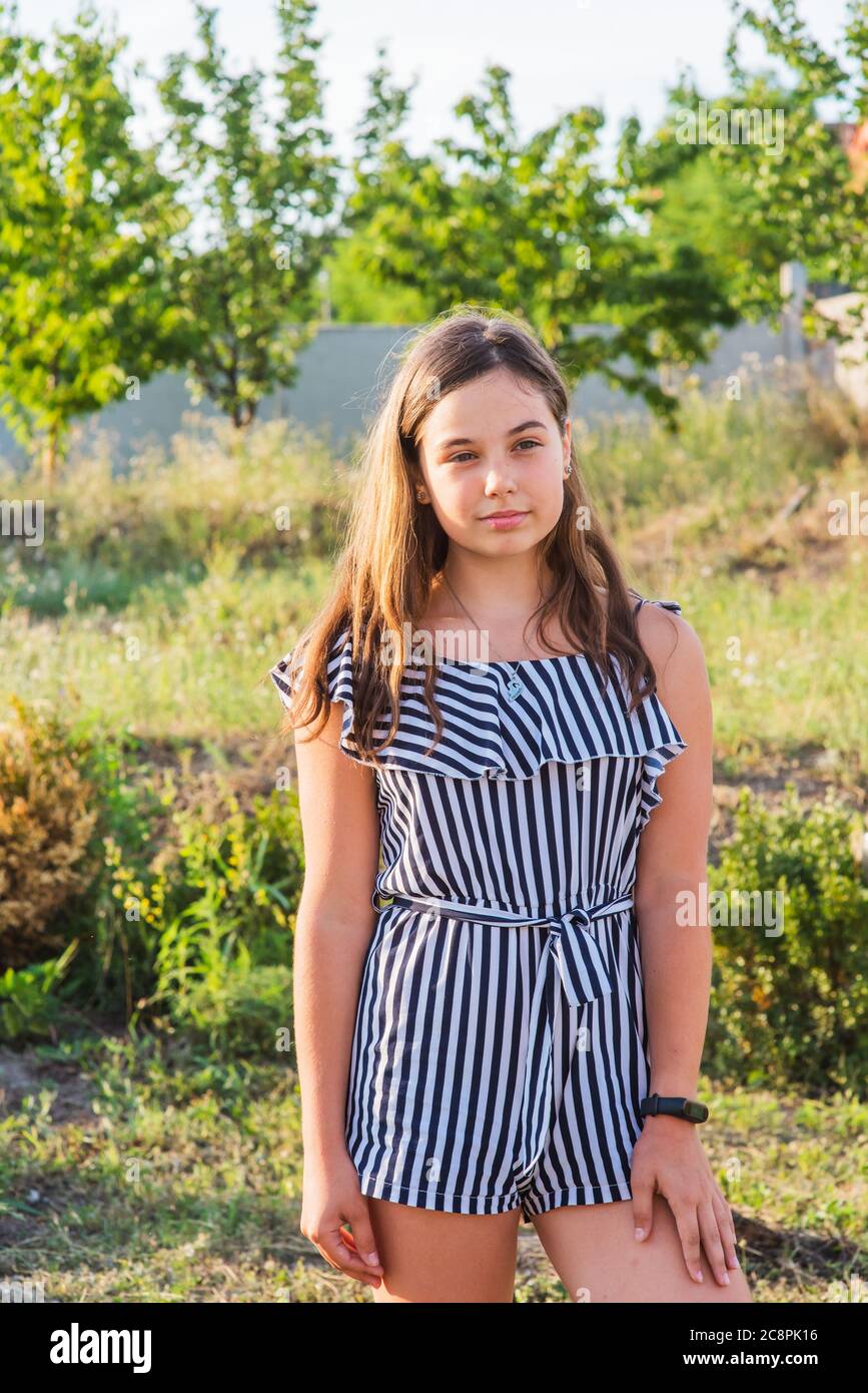 Outdoors portrait of beautiful young brunette girl Stock Photo - Alamy