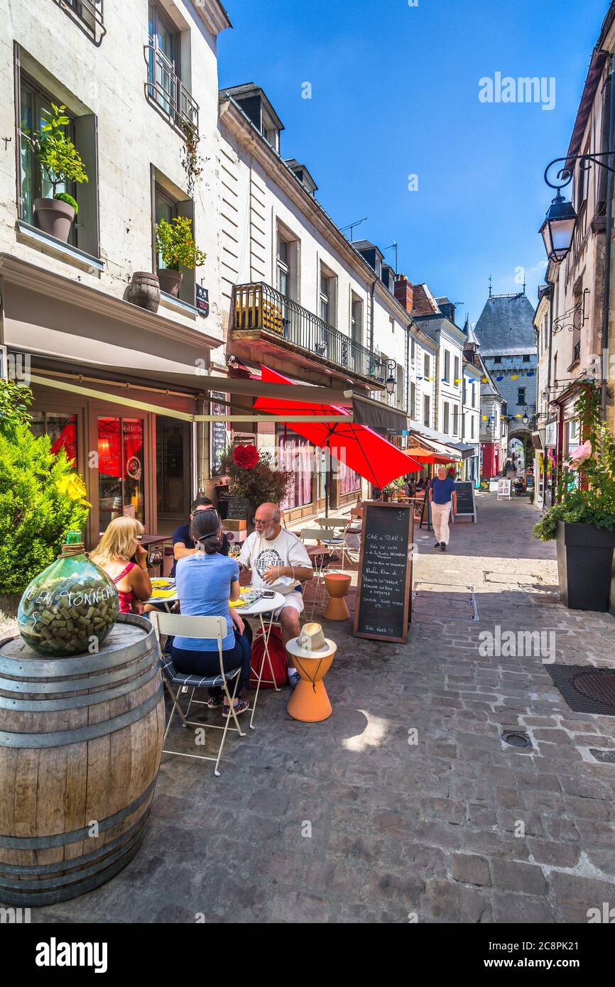 Outdoor restaurant tables with diners on the Grande Rue, Loches, Indre-et-Loire, France. Stock Photo