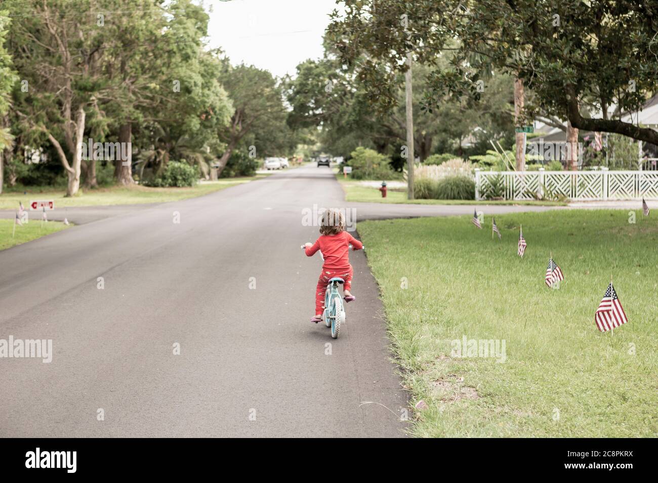 5 year old boy riding his bike, St. Simon's Island, Stock Photo