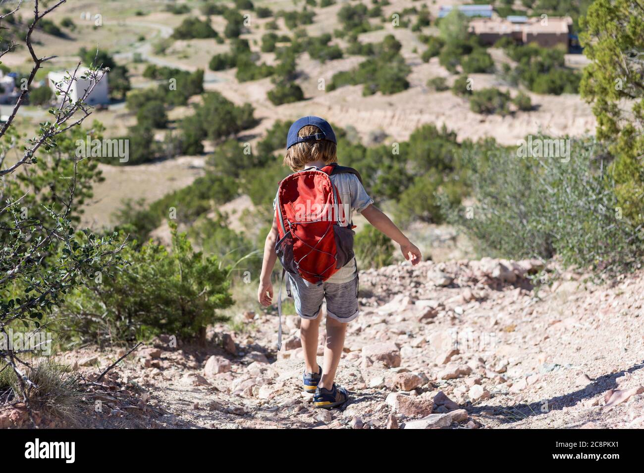 4 year old boy hiking in rural landscape, Lamy, NM. Stock Photo