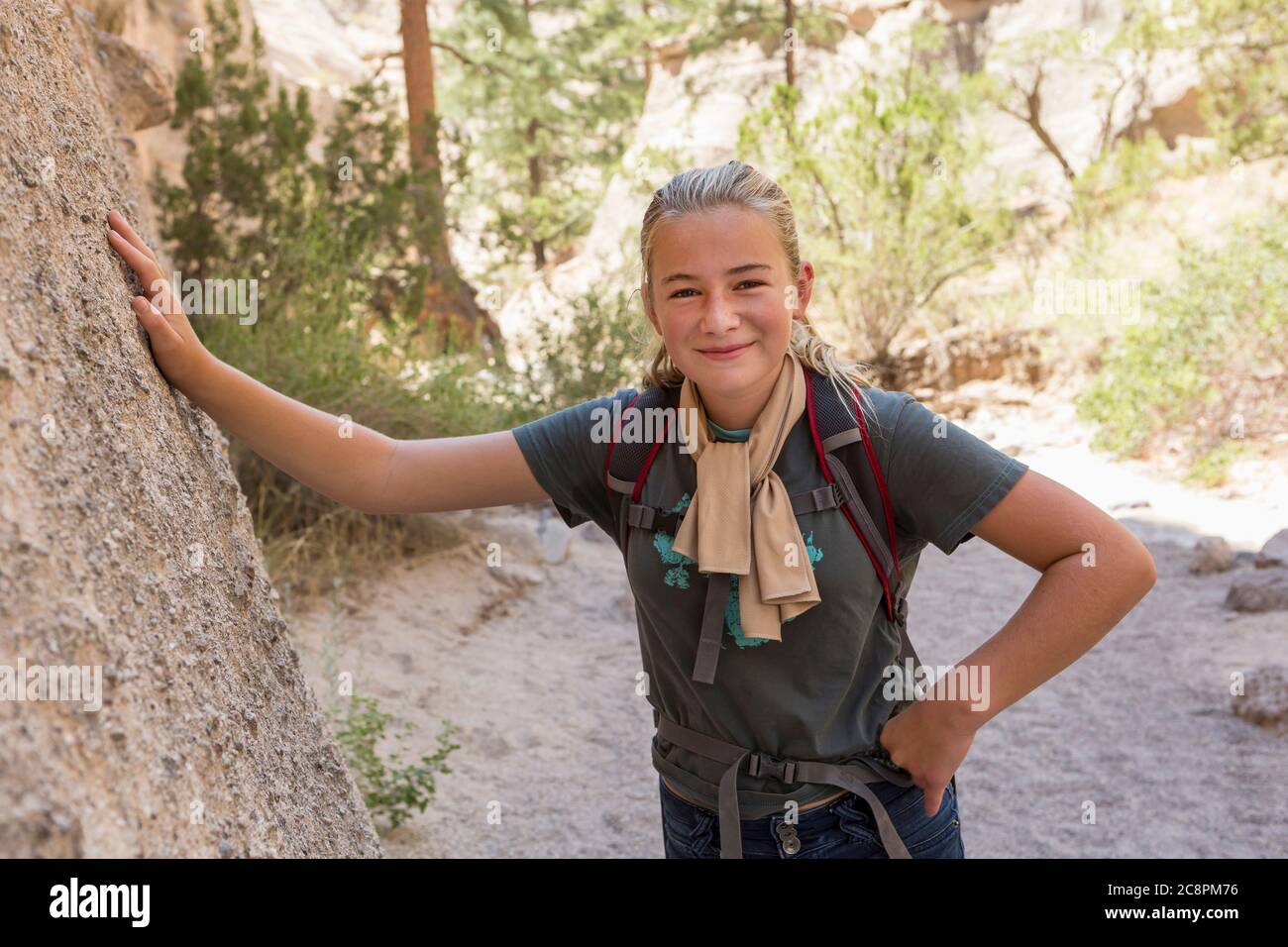 12 year old girl hiking in beautiful slot canyon, Kasha Katuwe, Tent Rocks, NM. Stock Photo