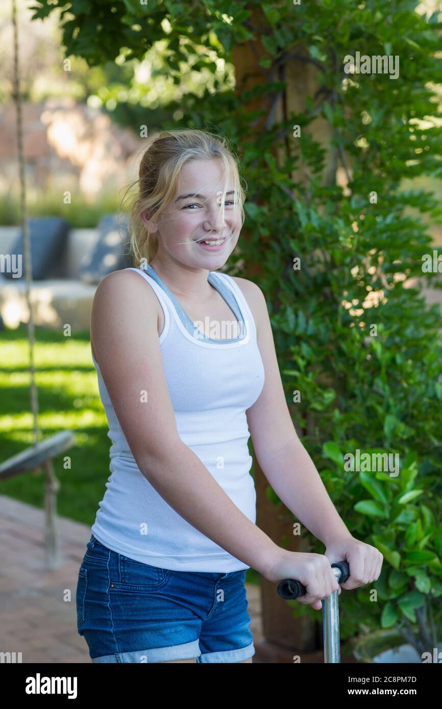 Portrait Of 11 Year Old Girl On Scooter Stock Photo Alamy portrait-of-11-year-old-girl-on-scooter-stock-photo-alamy