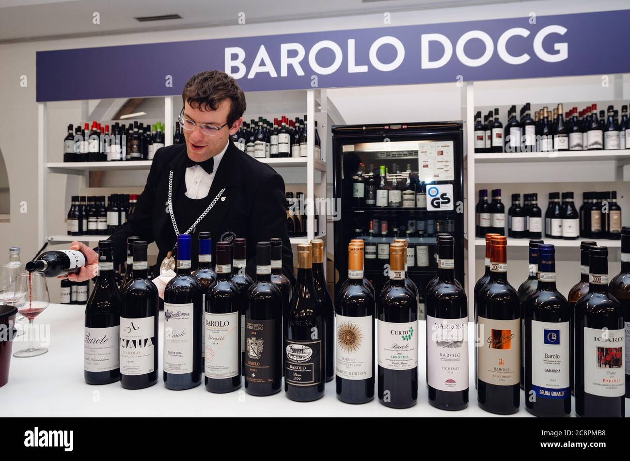 ALBA, ITALY - APRIL 25, 2019 – Sommelier and people tasting traditional red barolo wine of Piedmont at Vinum, wine e food show event of Alba, (Italy) Stock Photo
