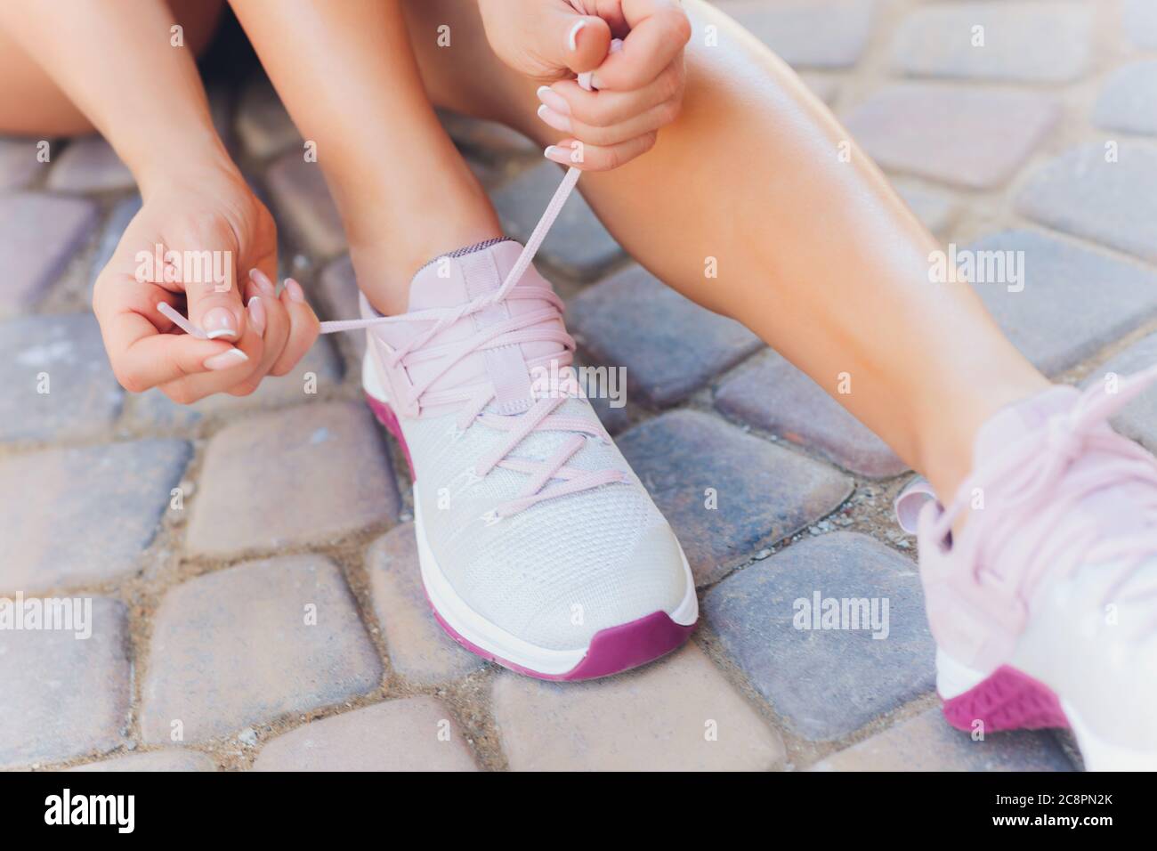 tan shoes and pink shoelaces