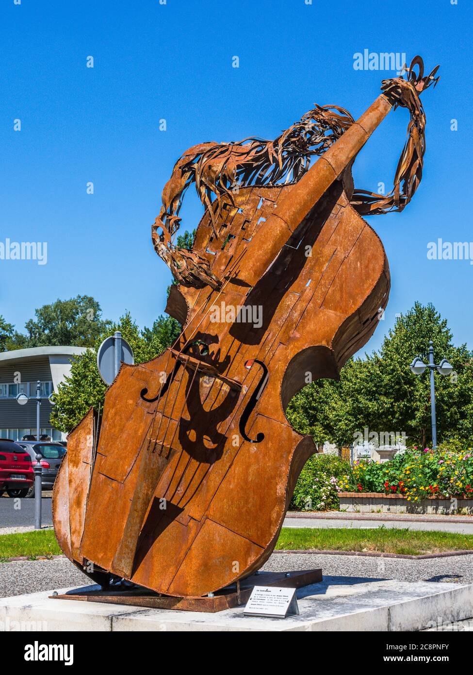 Rusty double bass sculpture "La Contrebasse" made by by Patrick Suskind in  1991 in centre of Perrusson, Indre-et-Loire, France Stock Photo - Alamy