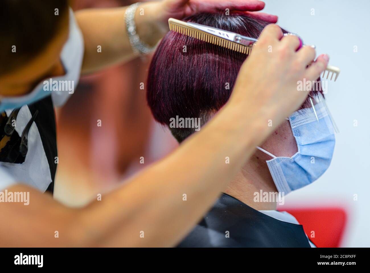 Hairdresser with precaution hires stock photography and images Alamy