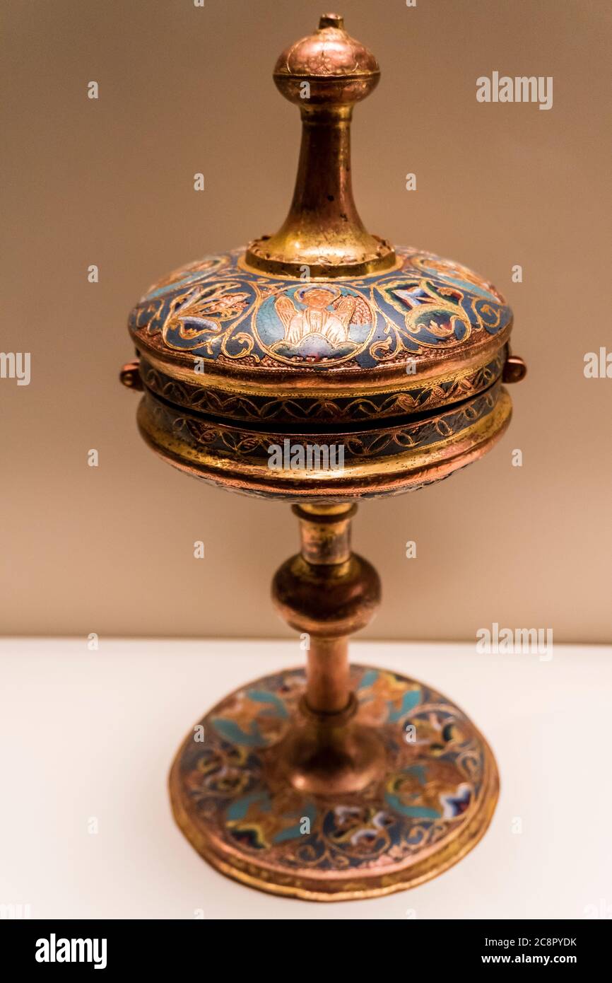 Romanesque art in the National Art Museum of Catalonia,Barcrelona,cup (1240 AC), cast bronze, chiseled and gilded. Stock Photo