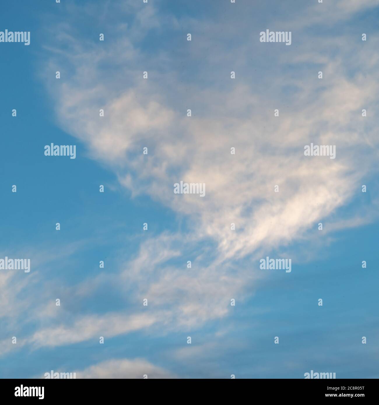 A photo of a beautiful white cloud against a blue sky Stock Photo - Alamy