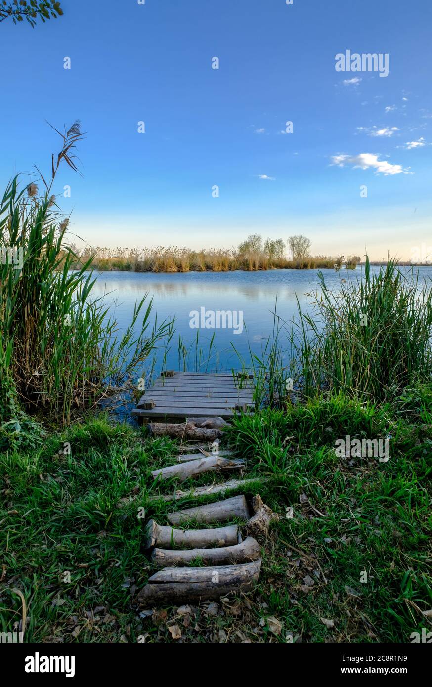 fishing pier in Almenara ponds wetland natural space Stock Photo