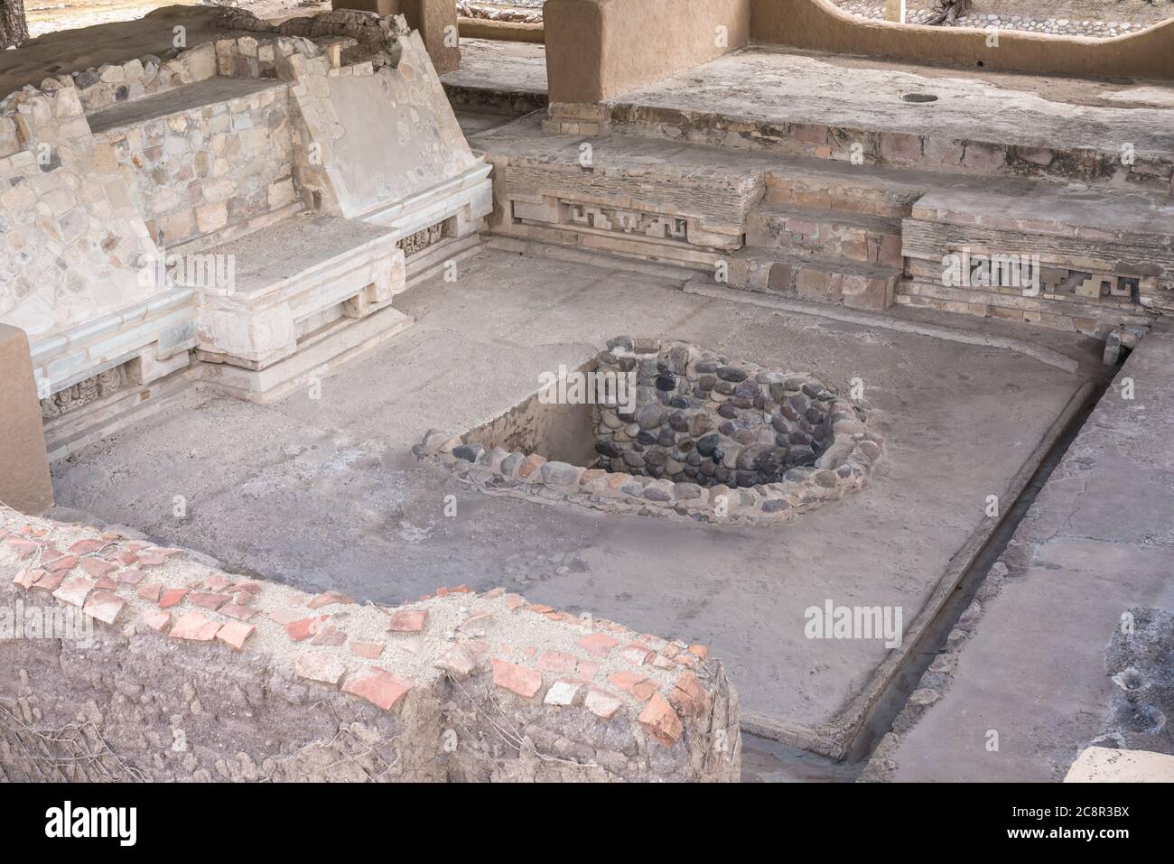The entrance to Tomb 6 in the floor of the Palace of the Racoqui or House of the Great Lord in Structure 195 in the pre-Hispanic Zapotec ruins of Lamb Stock Photo