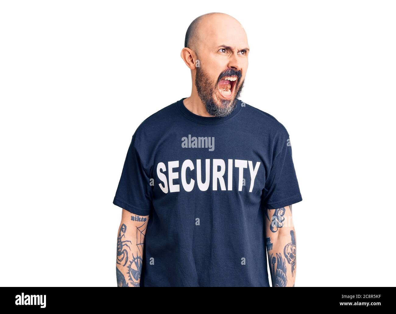 Young handsome man wearing security t shirt angry and mad screaming ...