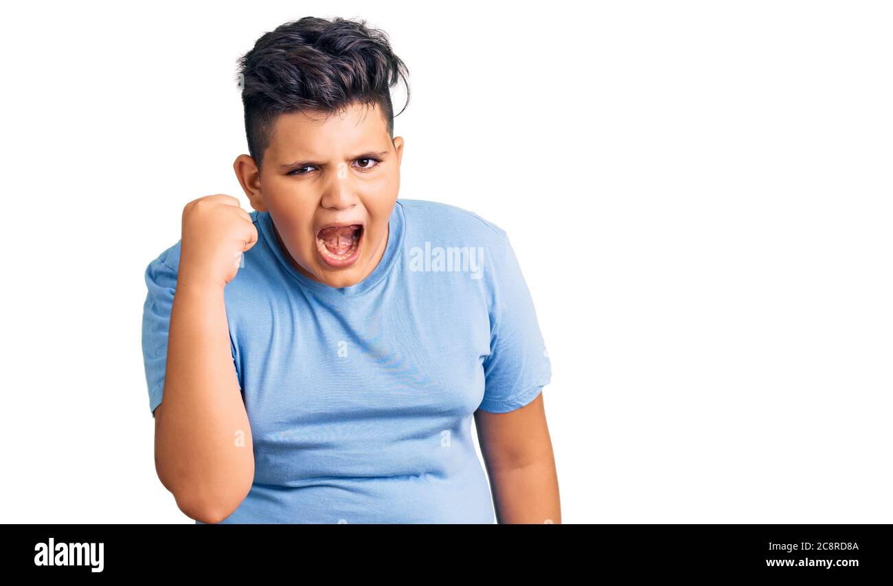 Little boy kid wearing sports workout clothes angry and mad