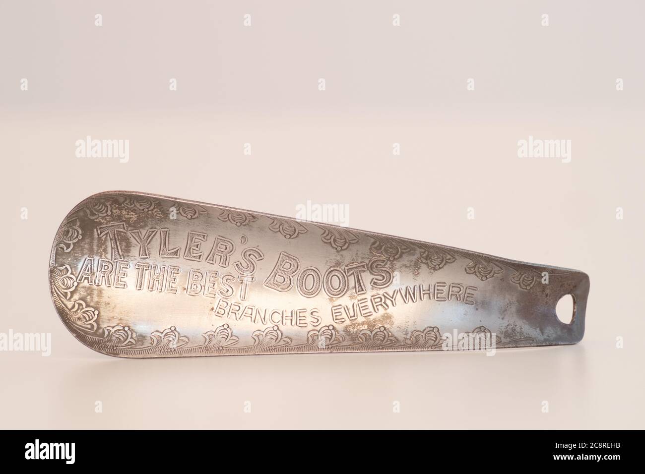 Vintage metal shoe horn. Inscription 