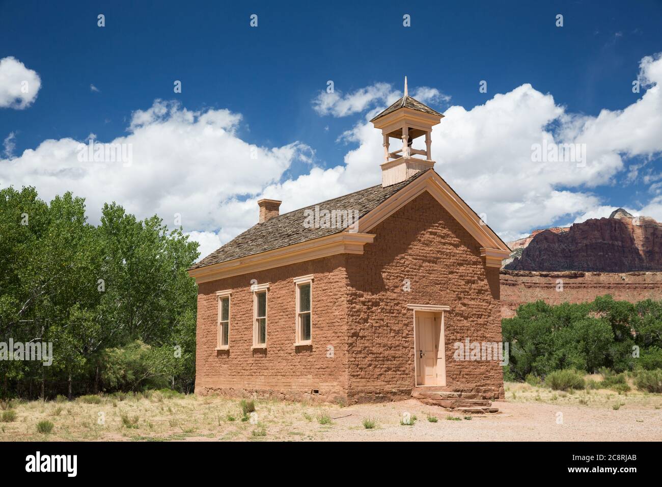 A small community school house leftover from the late 1800's in a small desert community, now an abandoned ghost town. Stock Photo