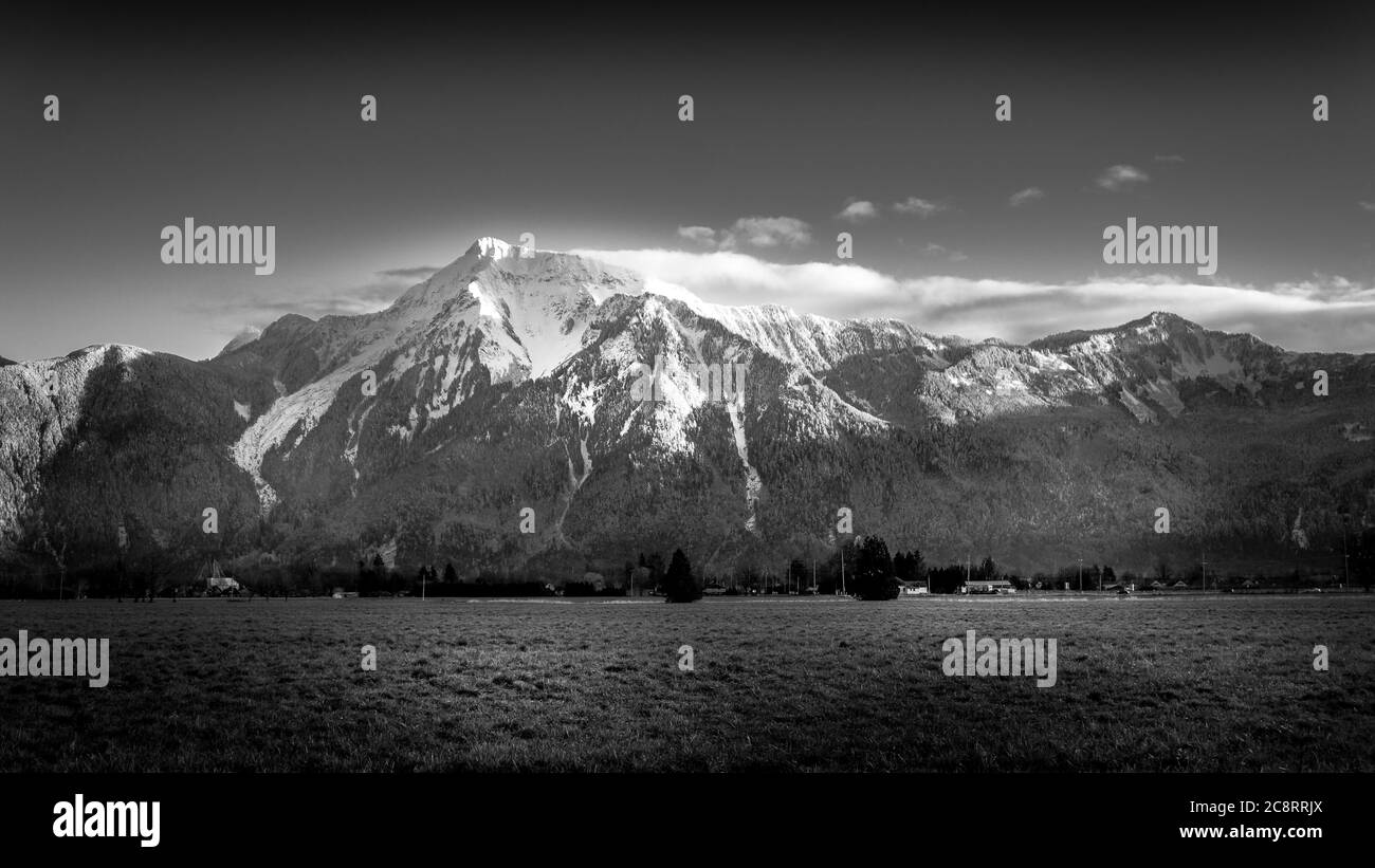 Black and White photo of Mount Cheam and the Farmlands in the Fraser Valley of British Columbia, Canada Stock Photo