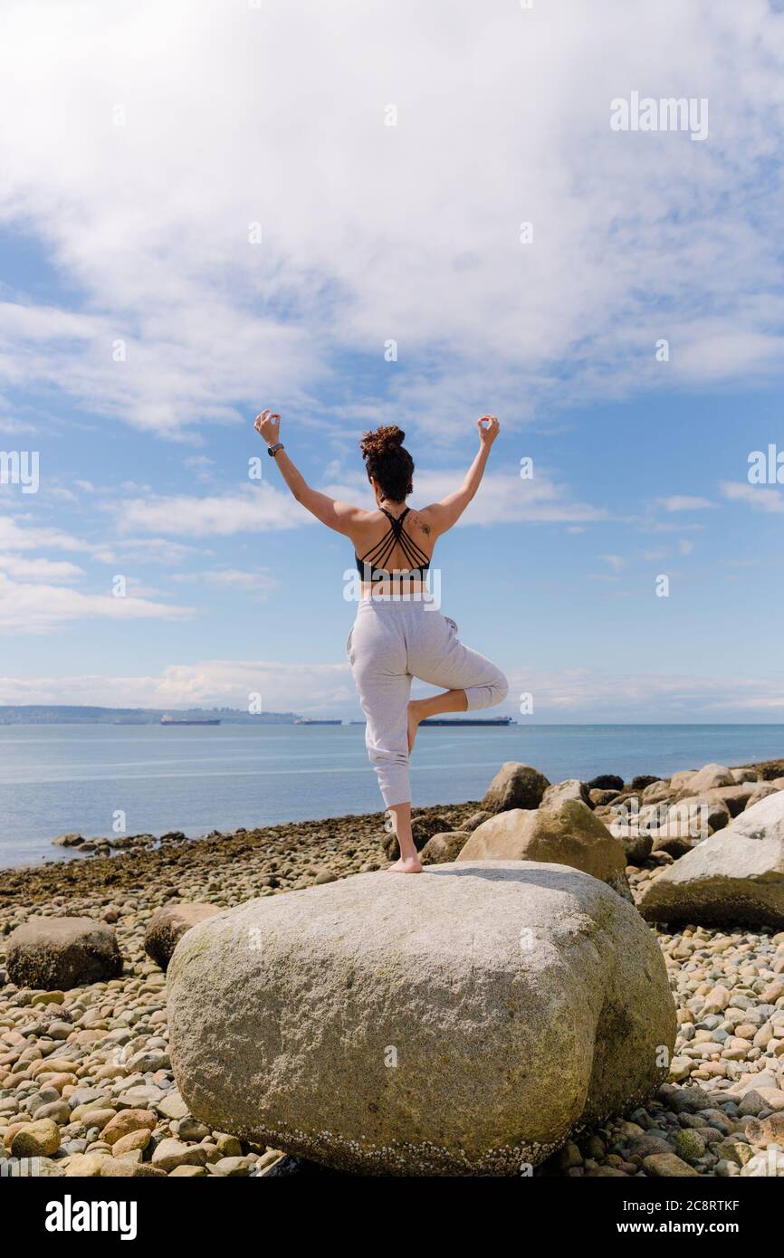 Young woman doing yoga poses Stock Photo