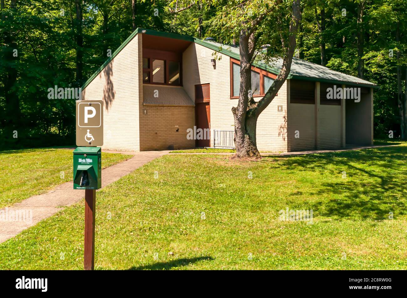 A building with men and women restrooms and showers in the Tionesta lake campground on a sunny summer day, Forest County, Pennsylvania, USA Stock Photo