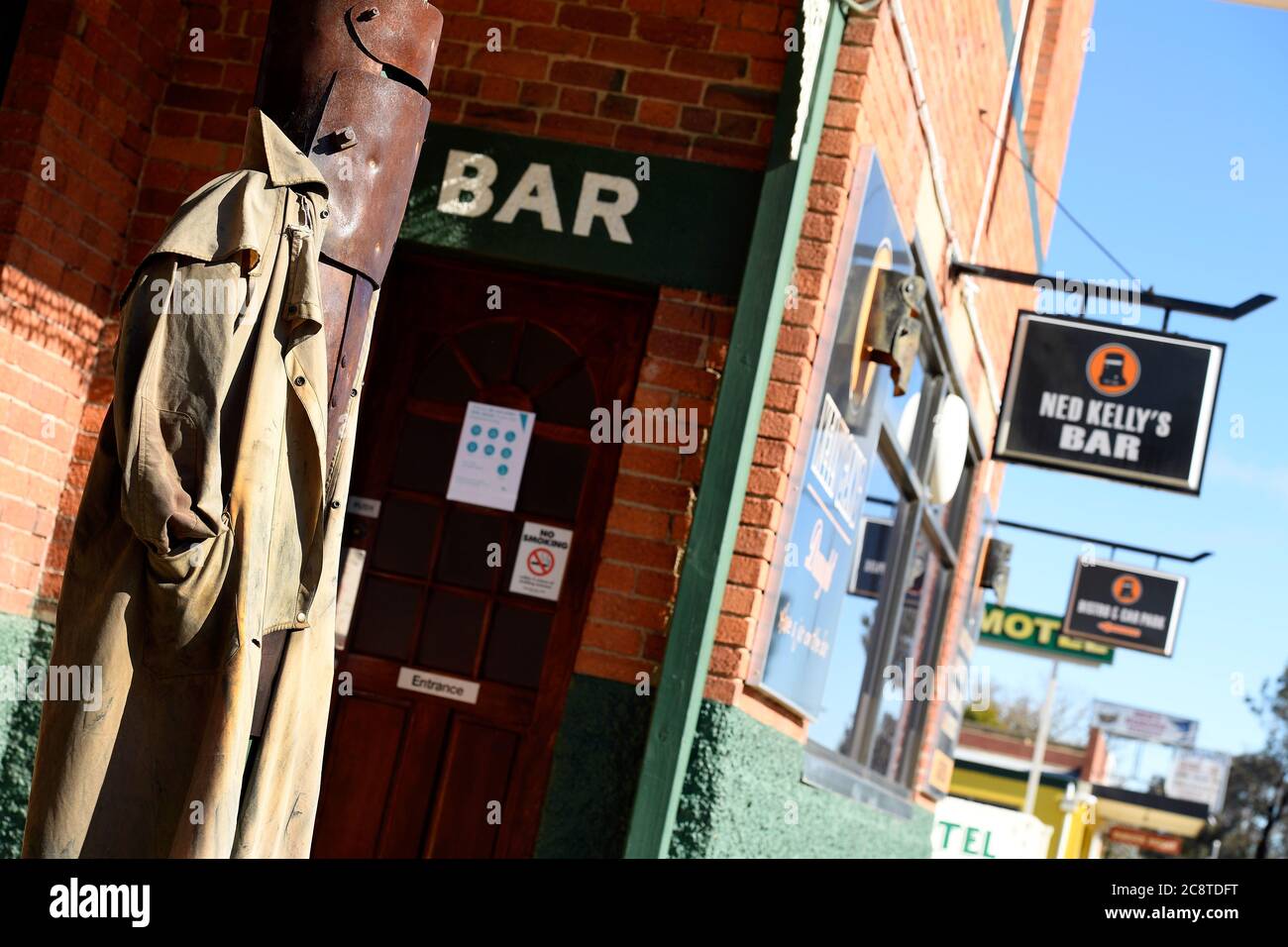 Glenrowan, Victoria. A Ned Kelly statue stands guard at the entrance to the bar of the Glenrowan Hotel in Gladstone Street, Glenrowan. Stock Photo