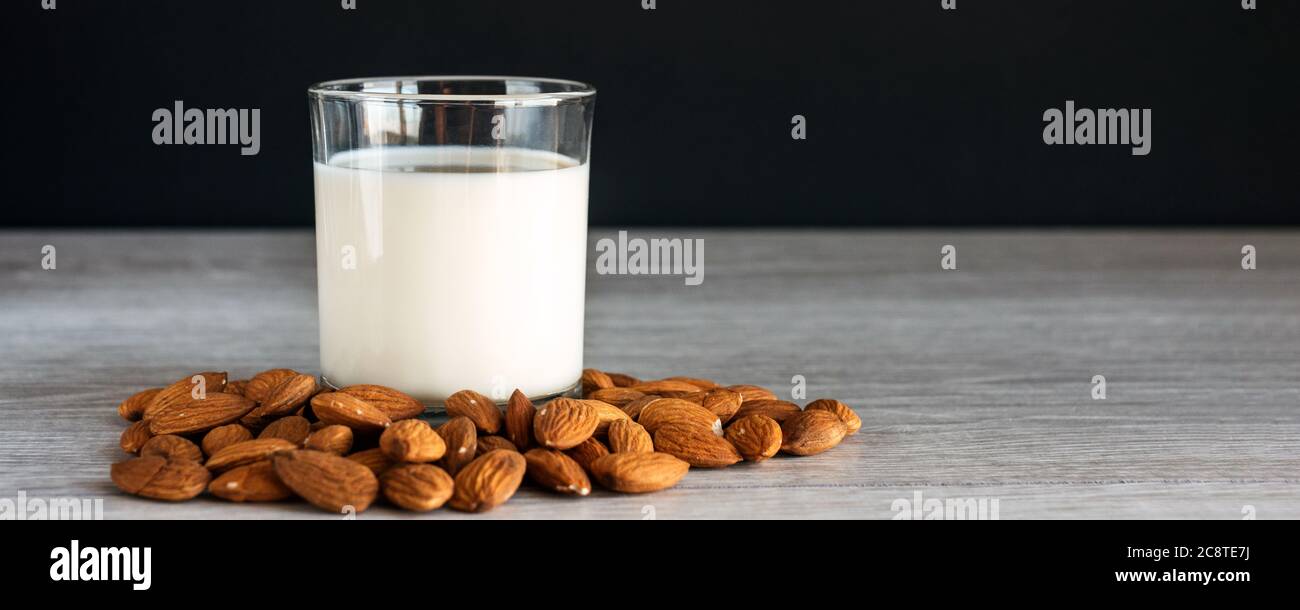 Banner with non dairy alternative milk, vegan almond milk  Stock Photo