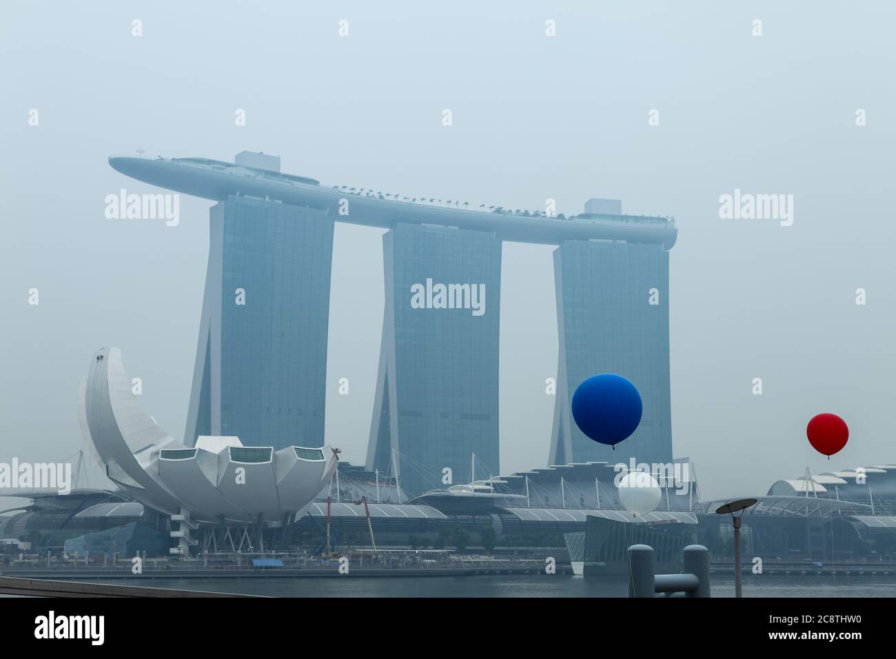 Marina Bay Sands cover with air pollution from the effect of deforestation from Indonesia. Singapore, Southeast Asia, Stock Photo