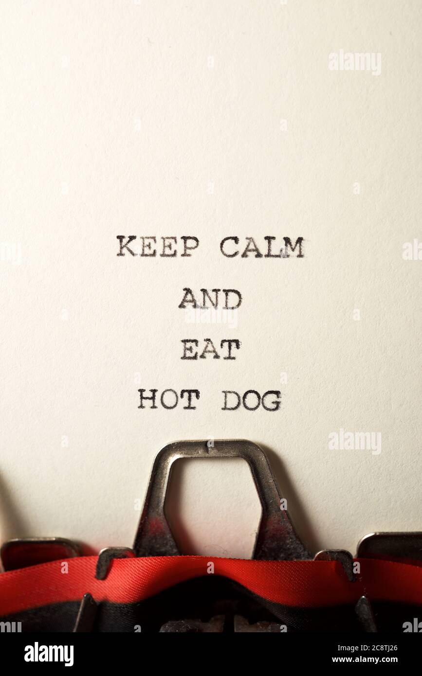 Keep calm and eat hot dog text written with a typewriter. Stock Photo