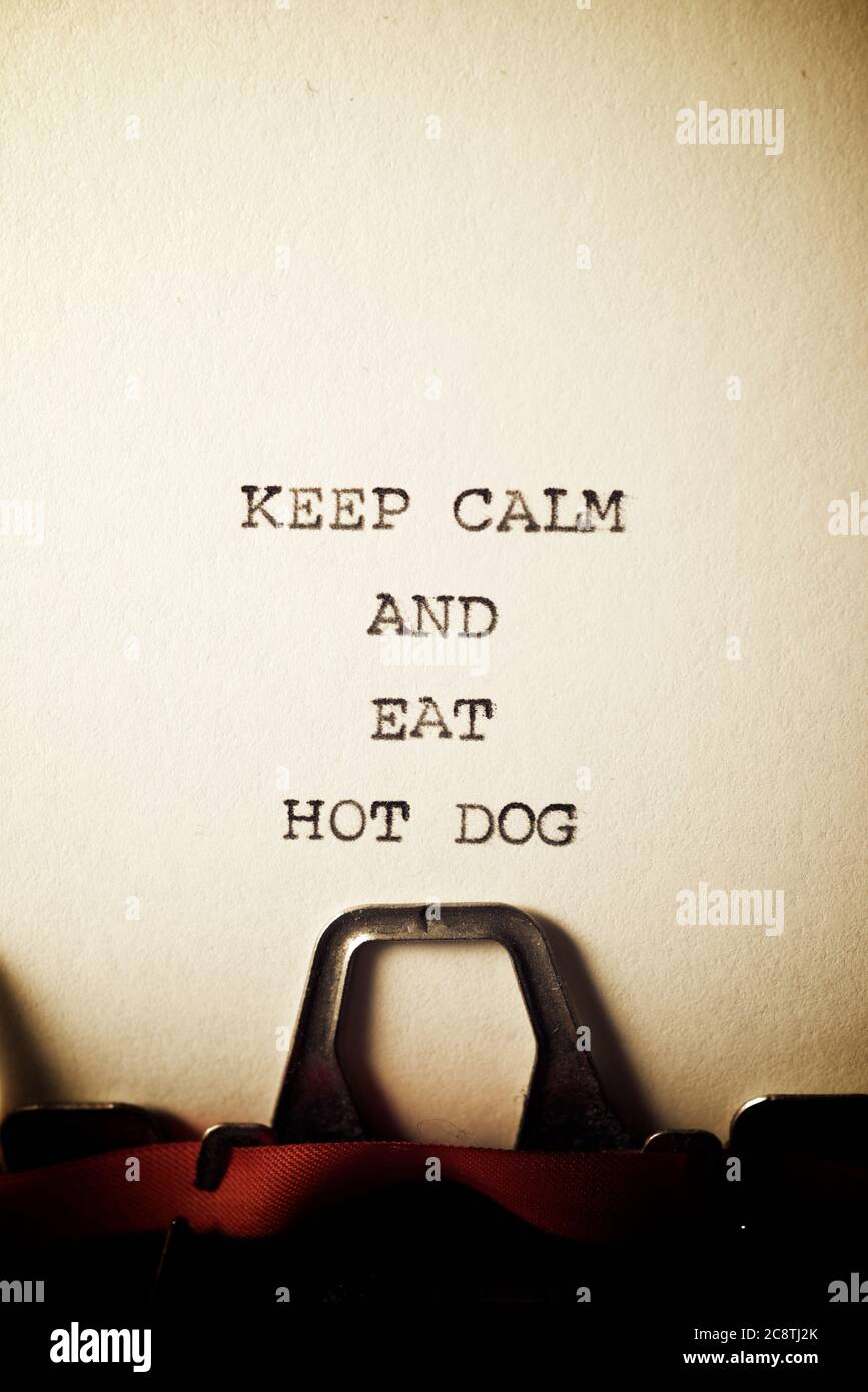 Keep calm and eat hot dog text written with a typewriter. Stock Photo