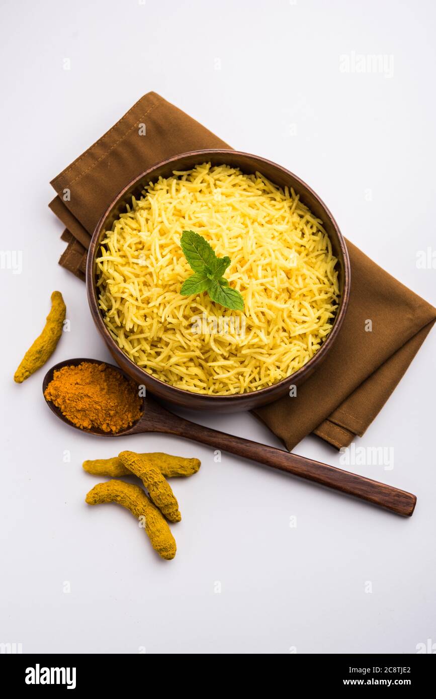 Cooked turmeric jasmine rice with powdered curcumin or Haldi, Indian
