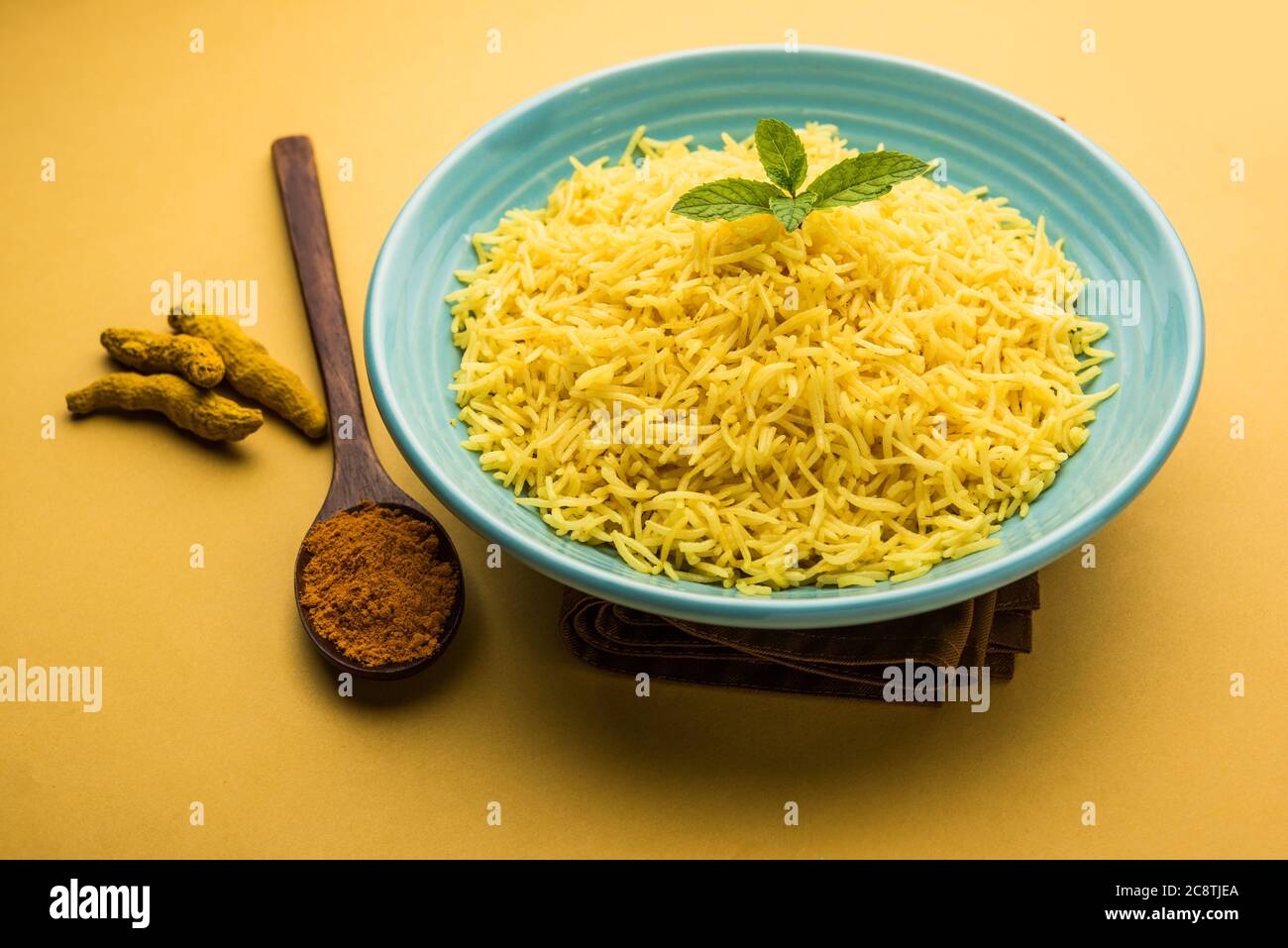 Cooked turmeric jasmine rice with powdered curcumin or Haldi, Indian