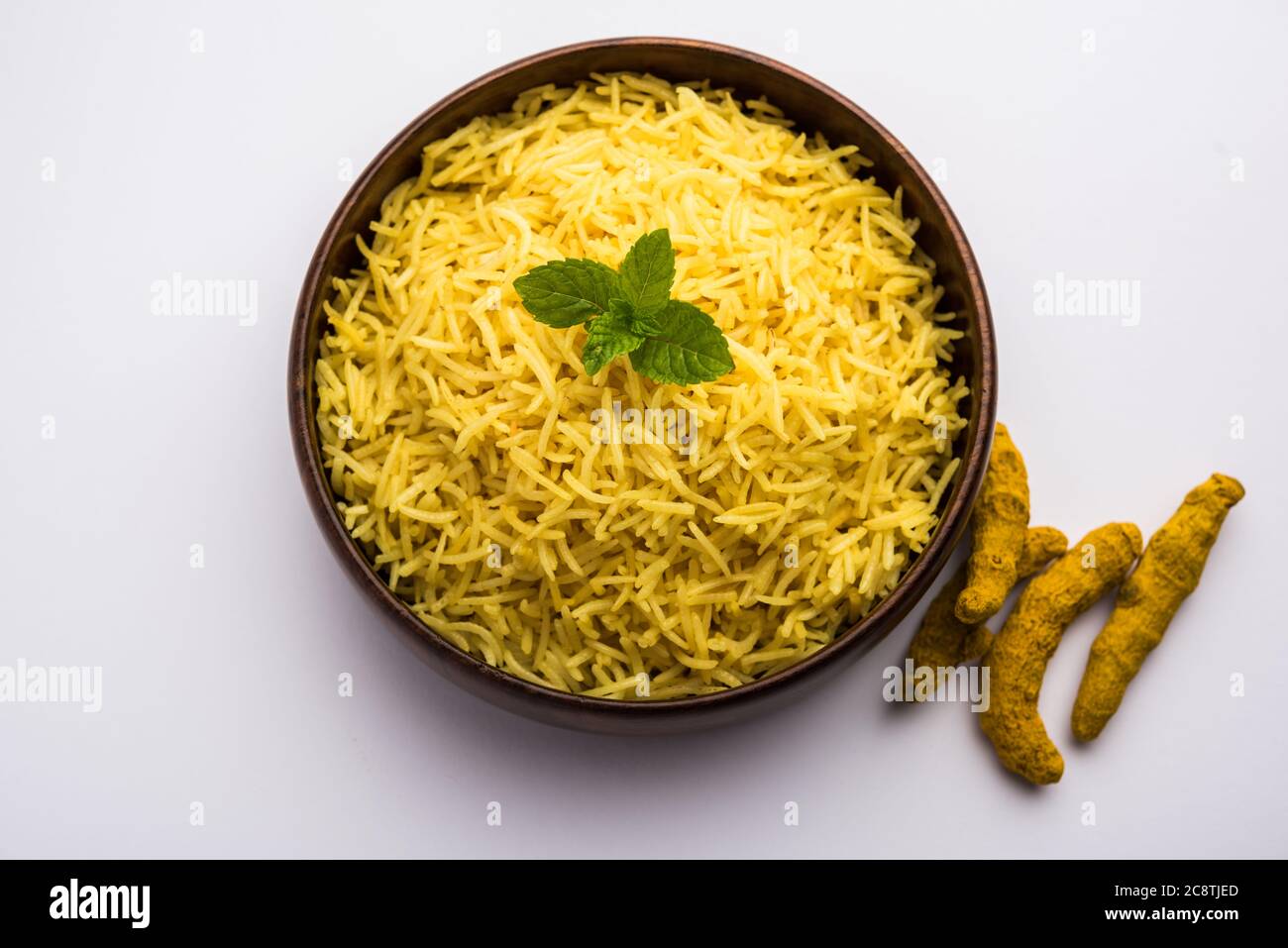 Cooked turmeric jasmine rice with powdered curcumin or Haldi, Indian