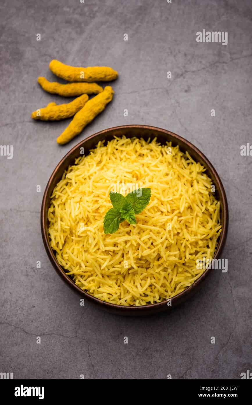 Cooked turmeric jasmine rice with powdered curcumin or Haldi, Indian