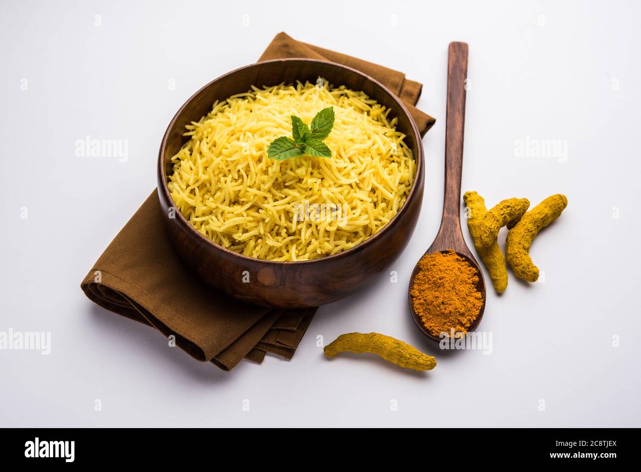 Cooked turmeric jasmine rice with powdered curcumin or Haldi, Indian