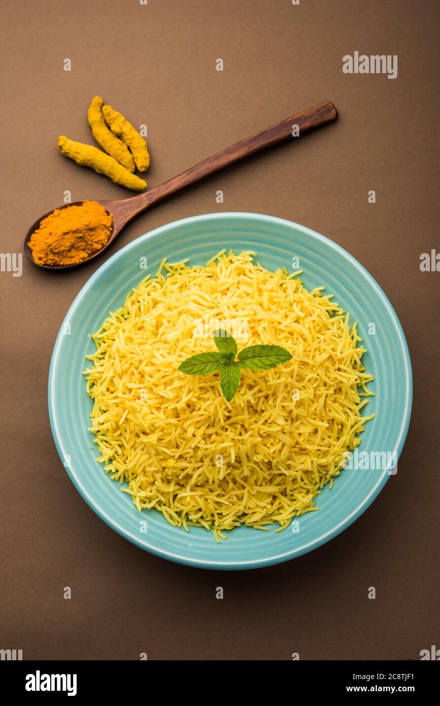 Cooked turmeric jasmine rice with powdered curcumin or Haldi, Indian