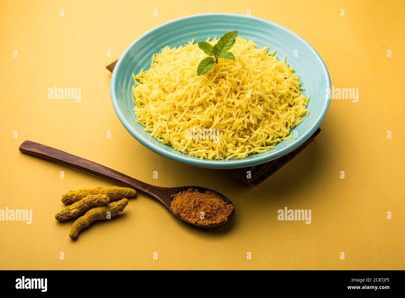 Cooked turmeric jasmine rice with powdered curcumin or Haldi, Indian