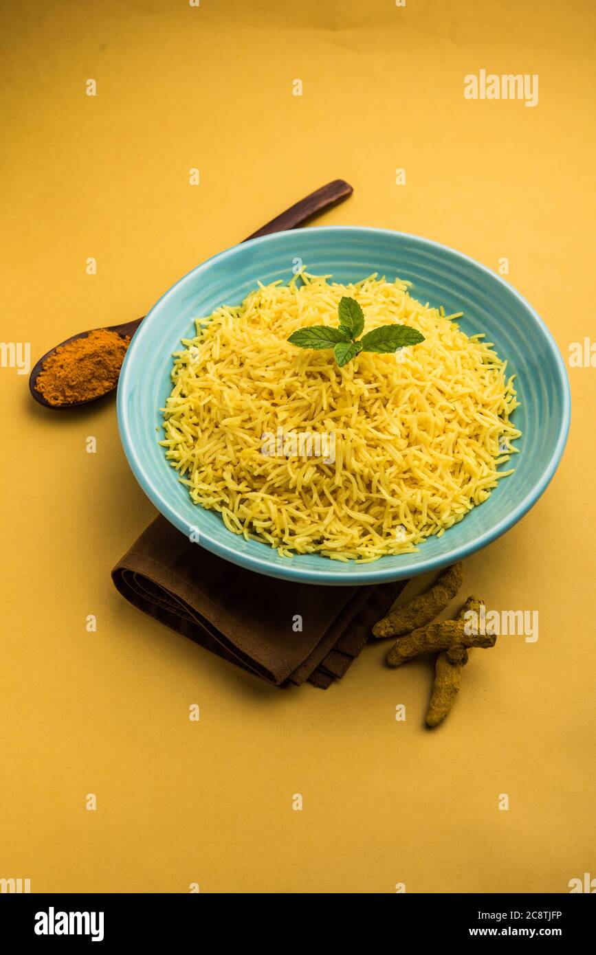 Cooked turmeric jasmine rice with powdered curcumin or Haldi, Indian