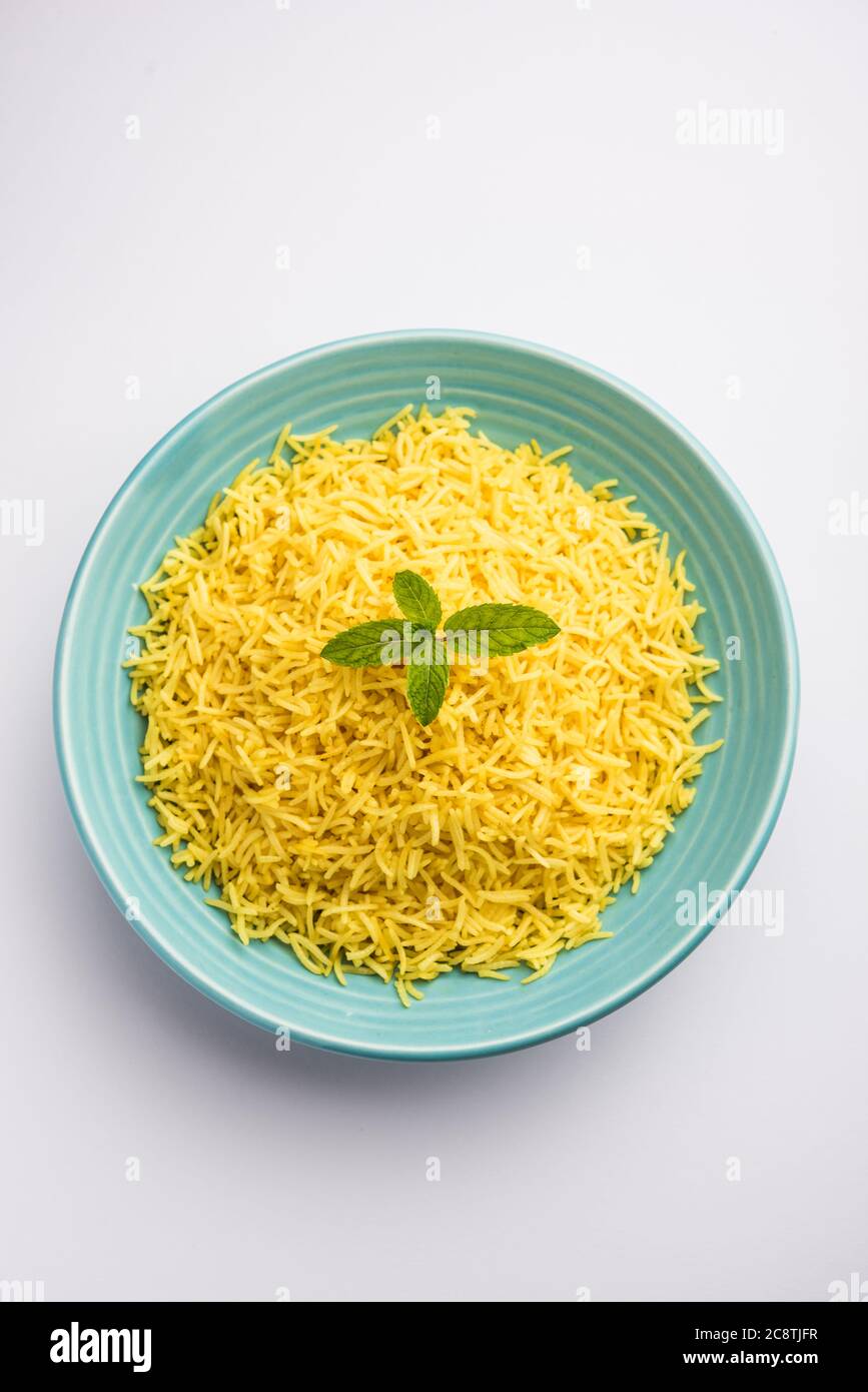 Cooked turmeric jasmine rice with powdered curcumin or Haldi, Indian
