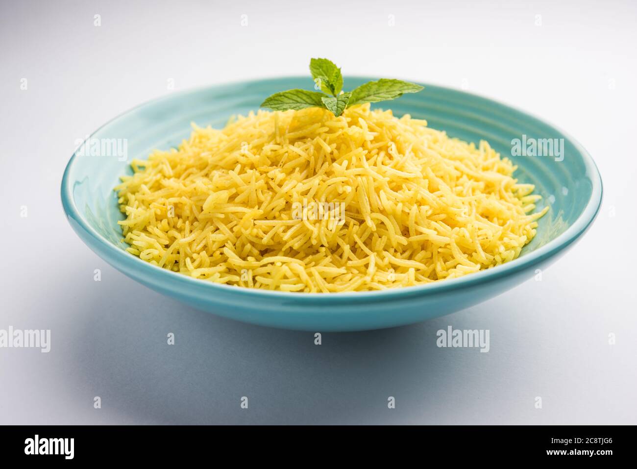 Cooked turmeric jasmine rice with powdered curcumin or Haldi, Indian food Stock Photo Alamy