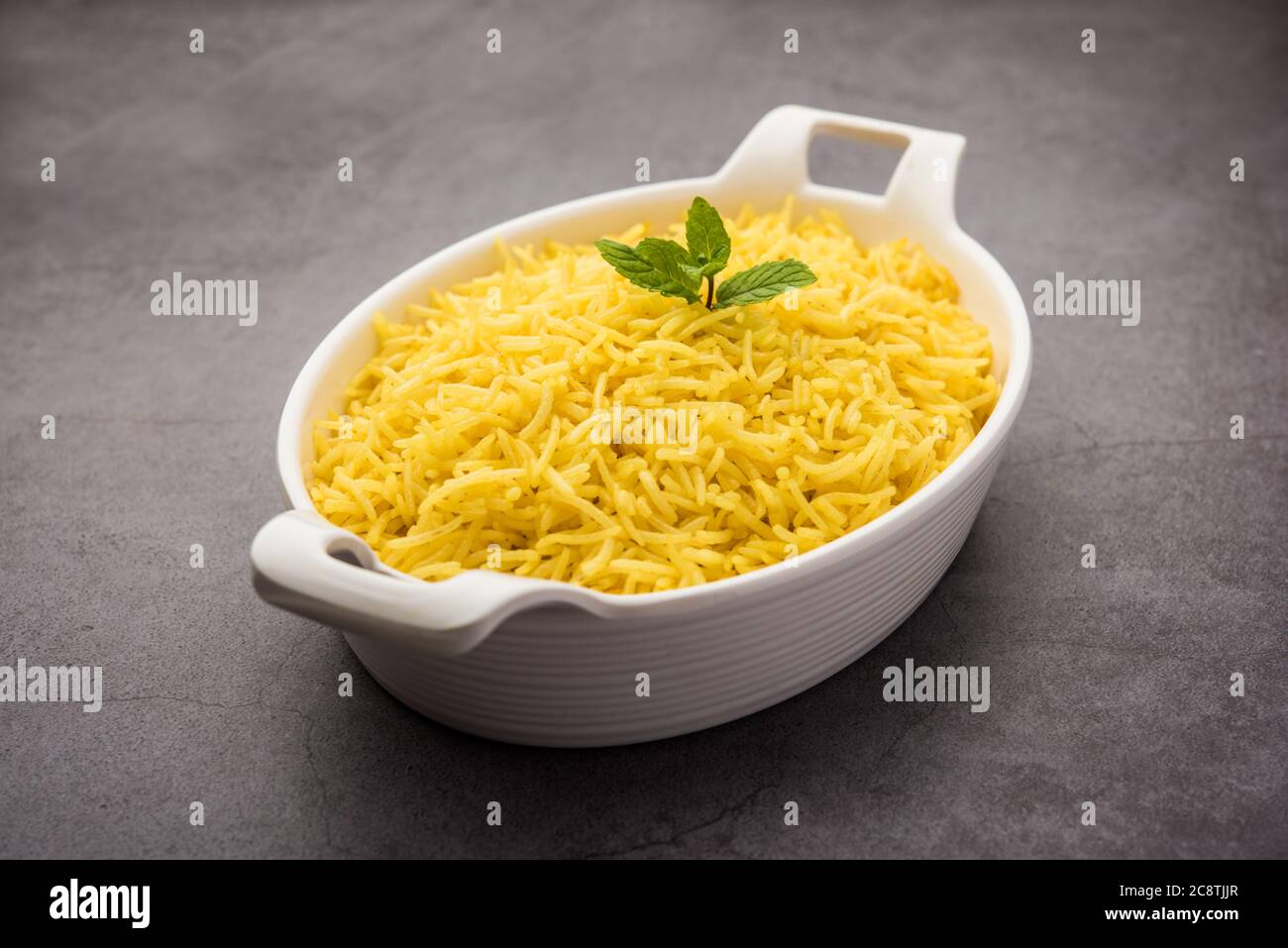 Cooked turmeric jasmine rice with powdered curcumin or Haldi, Indian