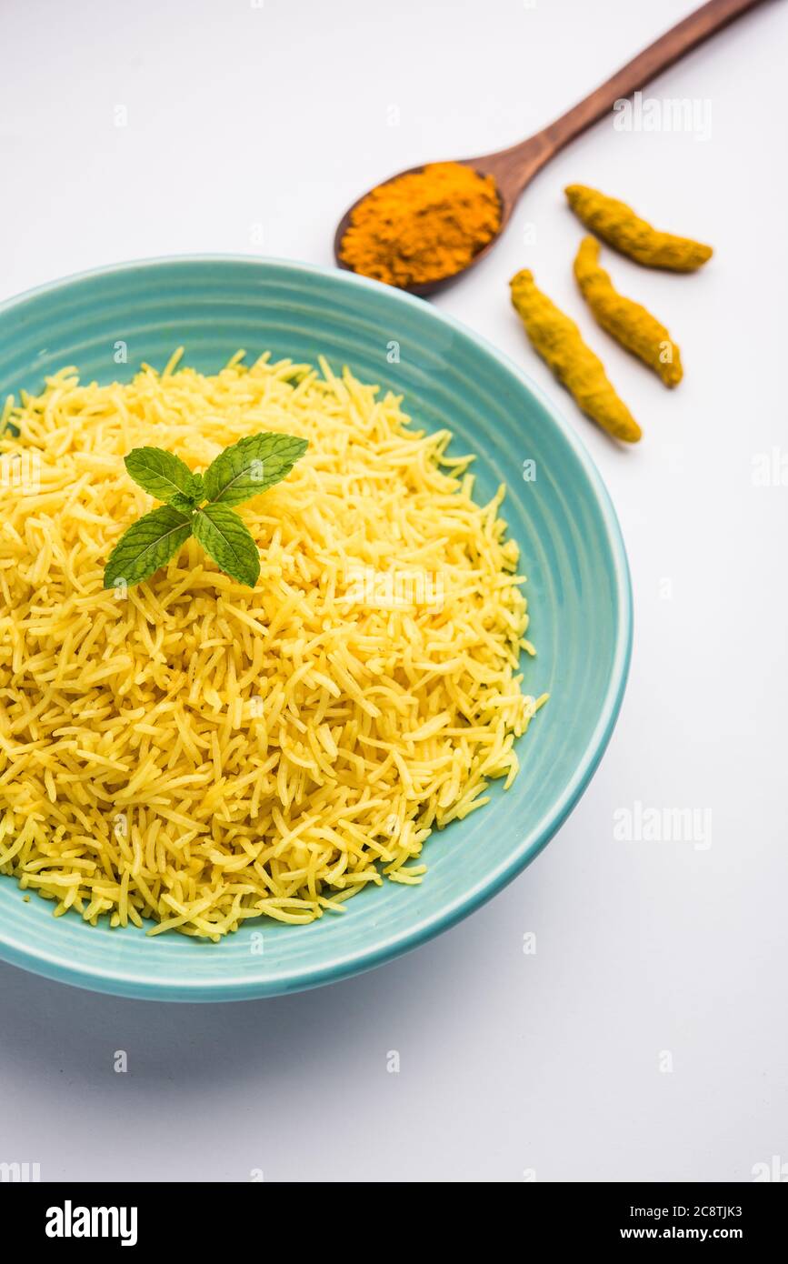 Cooked turmeric jasmine rice with powdered curcumin or Haldi, Indian