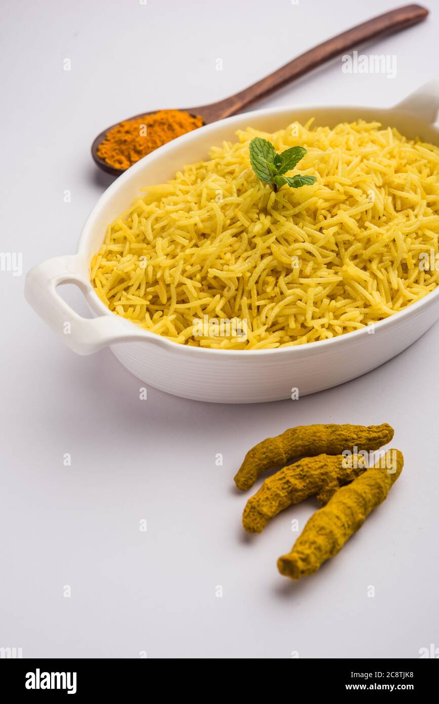 Cooked turmeric jasmine rice with powdered curcumin or Haldi, Indian