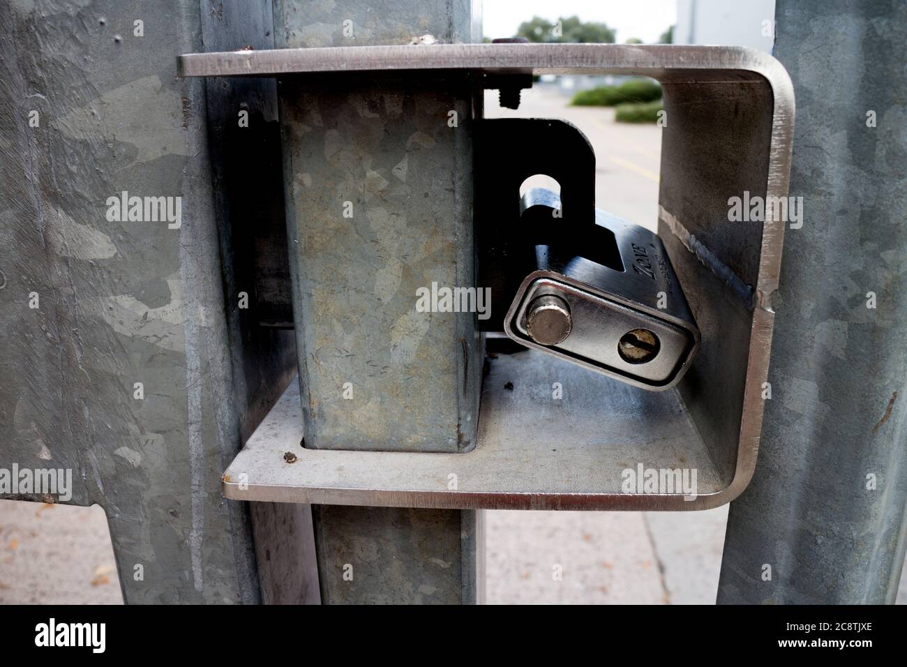 A sturdy lock on a metal gate, UK Stock Photo