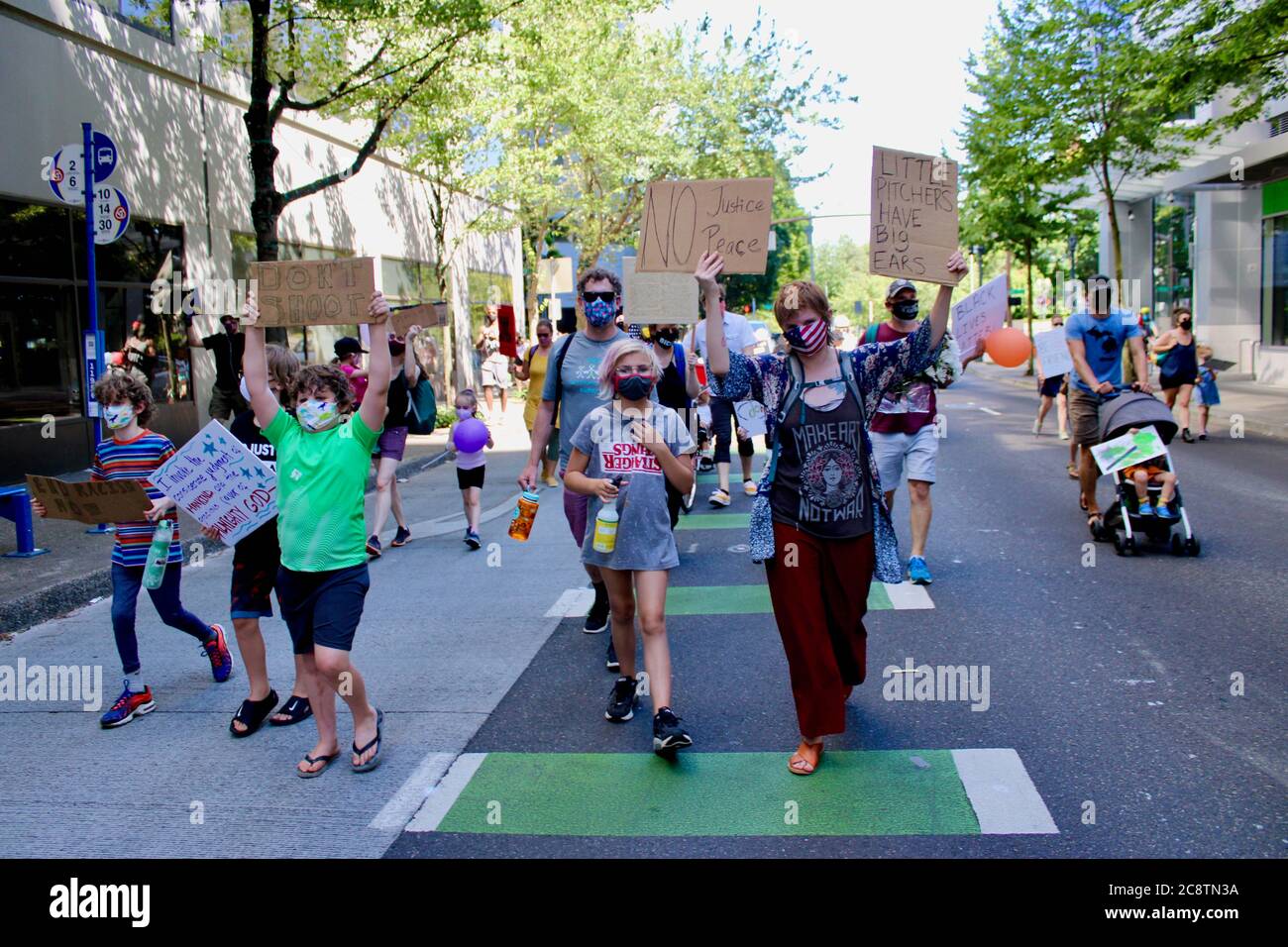Portland, Oregon, USA. 26th July, 2020. Kids and their parents marched today as part of "Families Demanding Feds Out of Portland"" an event organized by ."Raising Antiracist Kids PDX.""The march began at Salmon St. Fountain and ended at the Justice Center/Court house, where a young African American teen gave a heart-felt speech about equality and freedom. It was meant to "show the strength of local families who don't want DHS goons invading the city"", according to the Facebook page. Credit: Amy Katz/ZUMA Wire/Alamy Live News Stock Photo