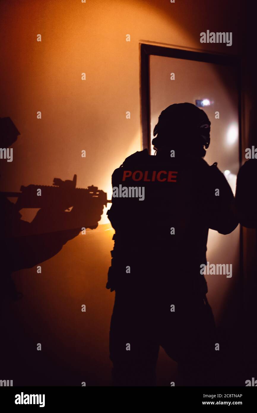 a police unit detains the perpetrator of a crime hidden in a building Stock Photo