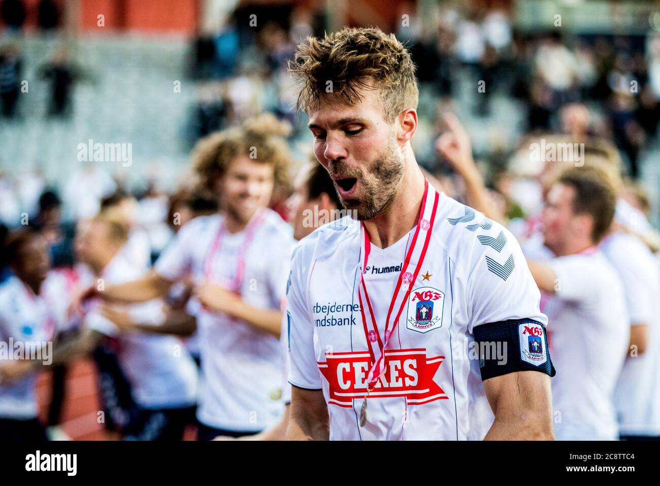 Aarhus, Denmark. 26th July, 2020. Patrick Mortensen of AGF is celebrating  bronze medals with the fans after the 3F Superliga match between AGF and  Brondby IF at Ceres Park in Aarhus. (Photo