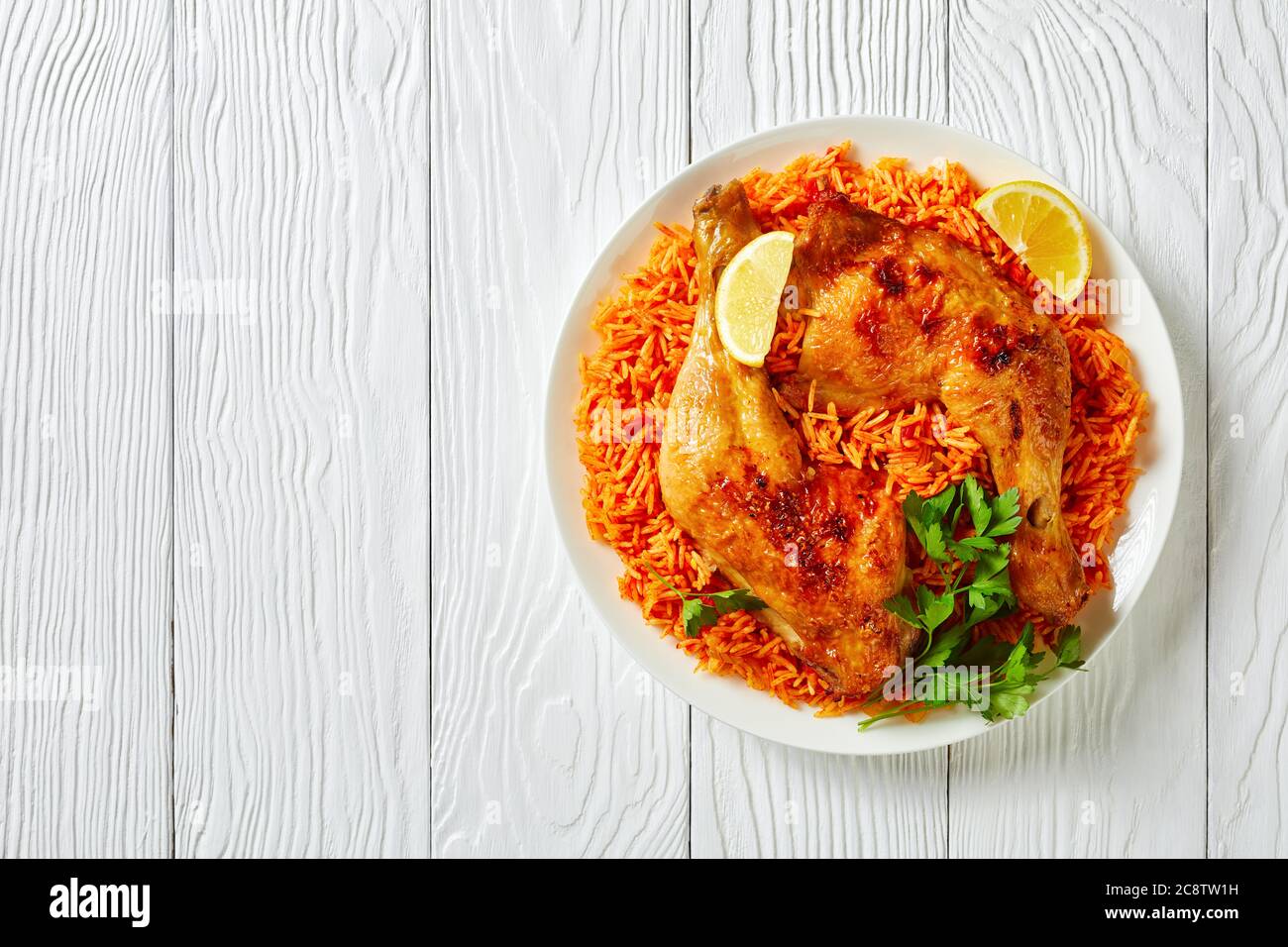 Indian tomato rice with roasted chicken quarters cooked of basmati rice