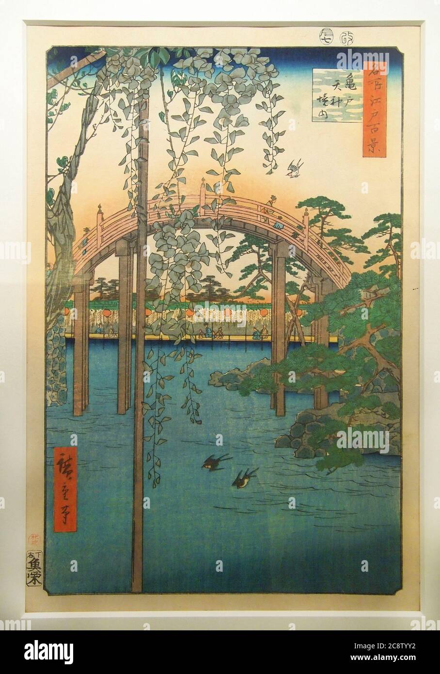 Utagawa Hiroshige. Bridge in Garden (1858). Drum bridge and garden at Kameido Tenjin Shrine (Tokyo). Flowering wisteria indicates summer season. Stock Photo