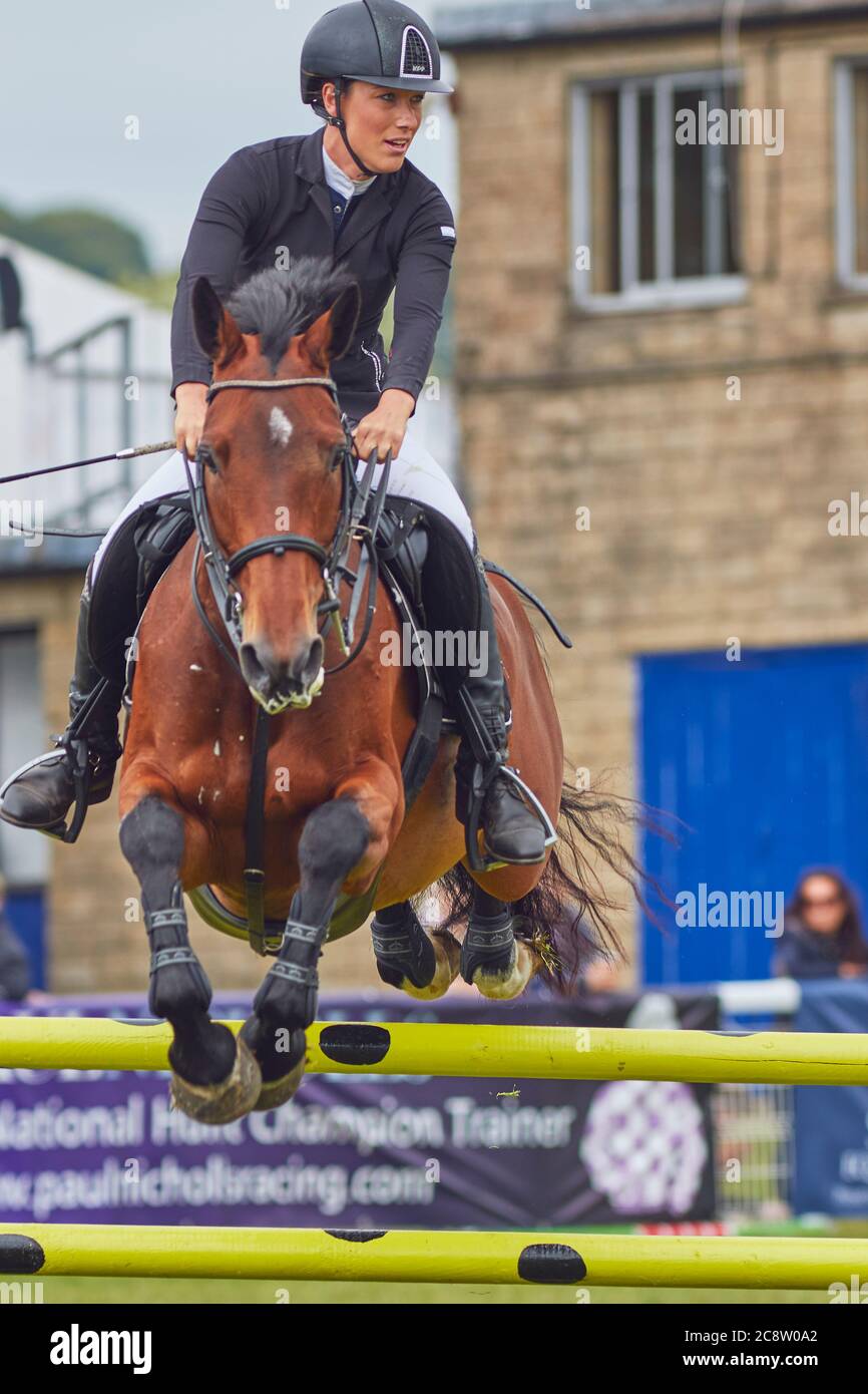 A show jumping competition at an agricultural show; the Royal Bath and West Show, near Shepton Mallet, Somerset, Great Britain. Stock Photo