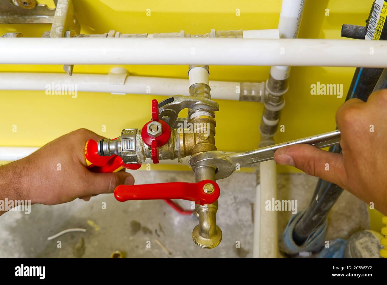 connecting plumbing fittings with keys. The plumber assembles a new