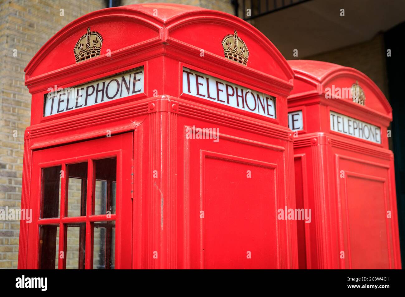 Red telephone box, Iconic british phone boxes or booths  in London, England, United Kingdom Stock Photo